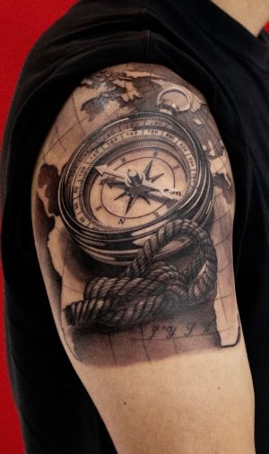 A realistic compass tattoo which was made at Dragon City Ink Da Nang.